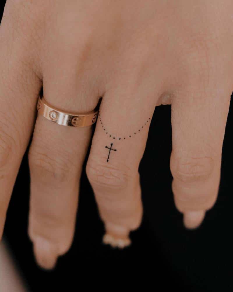 Cross Tattoo on finger