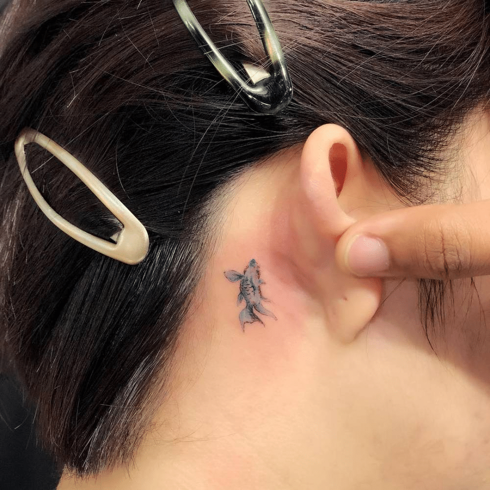 Tiny Fish Tattoo Behind the Ear
