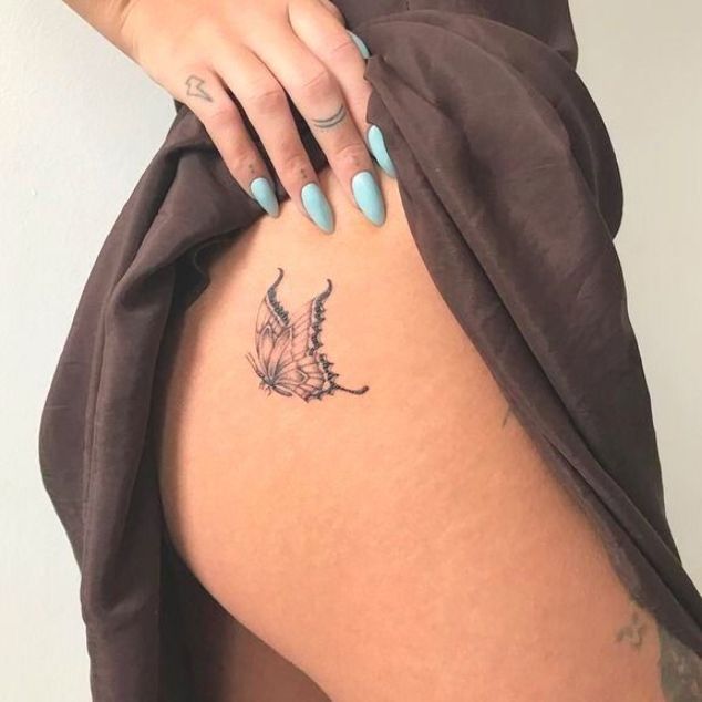butterfly tattoo on side hip