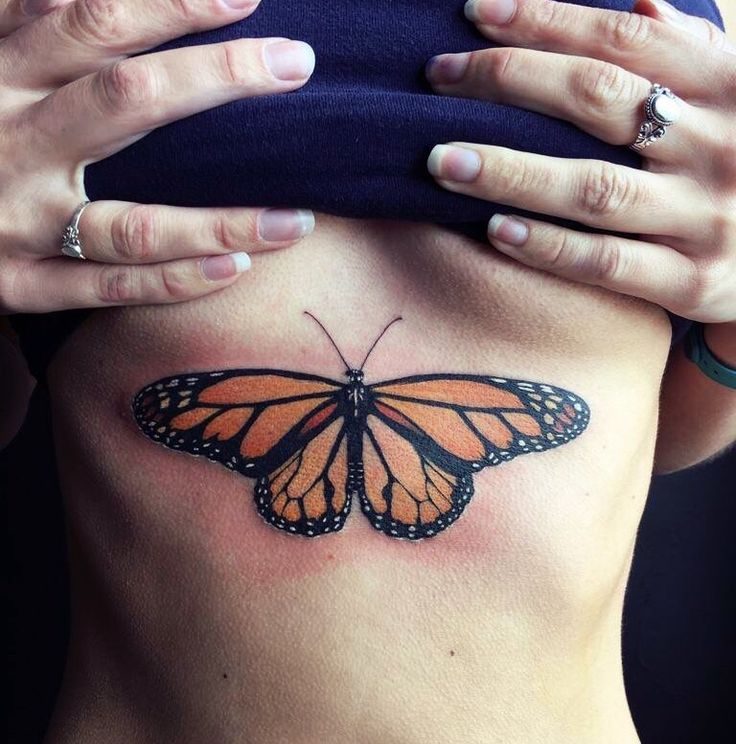 butterfly tattoo on sternum