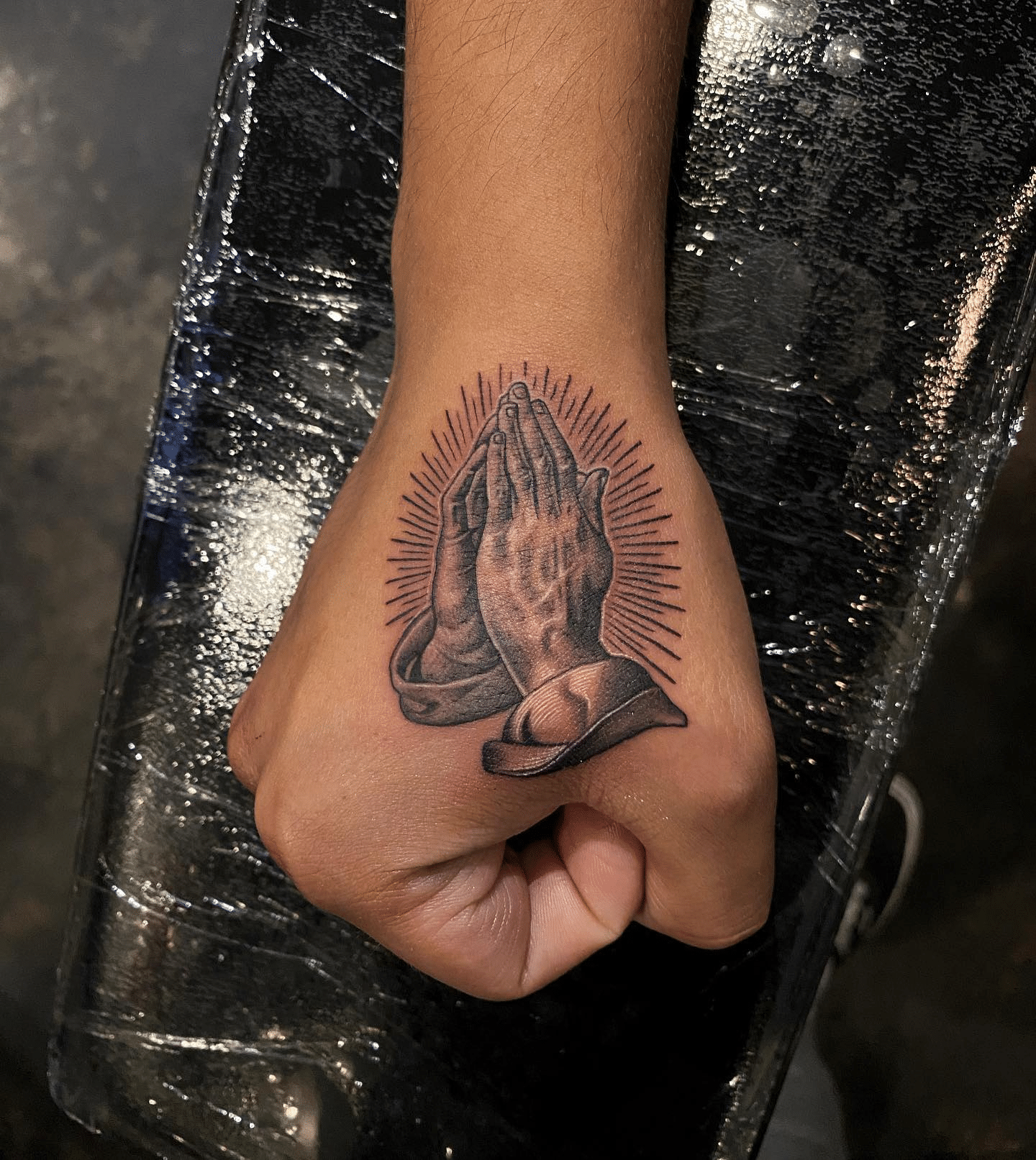 hand tattoo above thumb