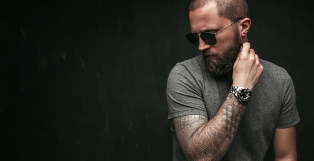 handsome guy with tattoo on arm portrait