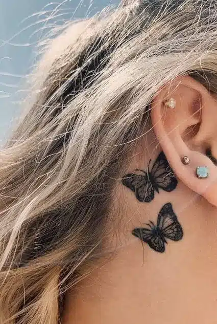 Behind the ear butterfly tattoo