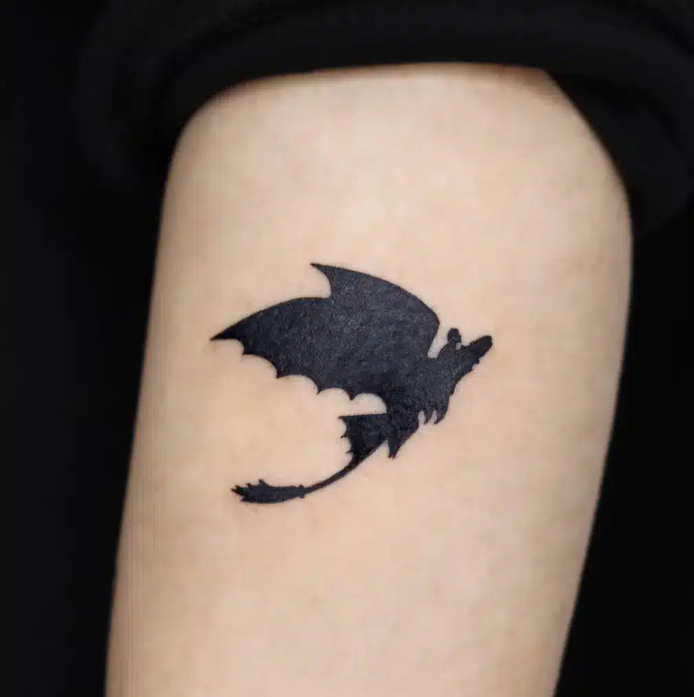 Black silhouette tiny dragon tattoo ideas