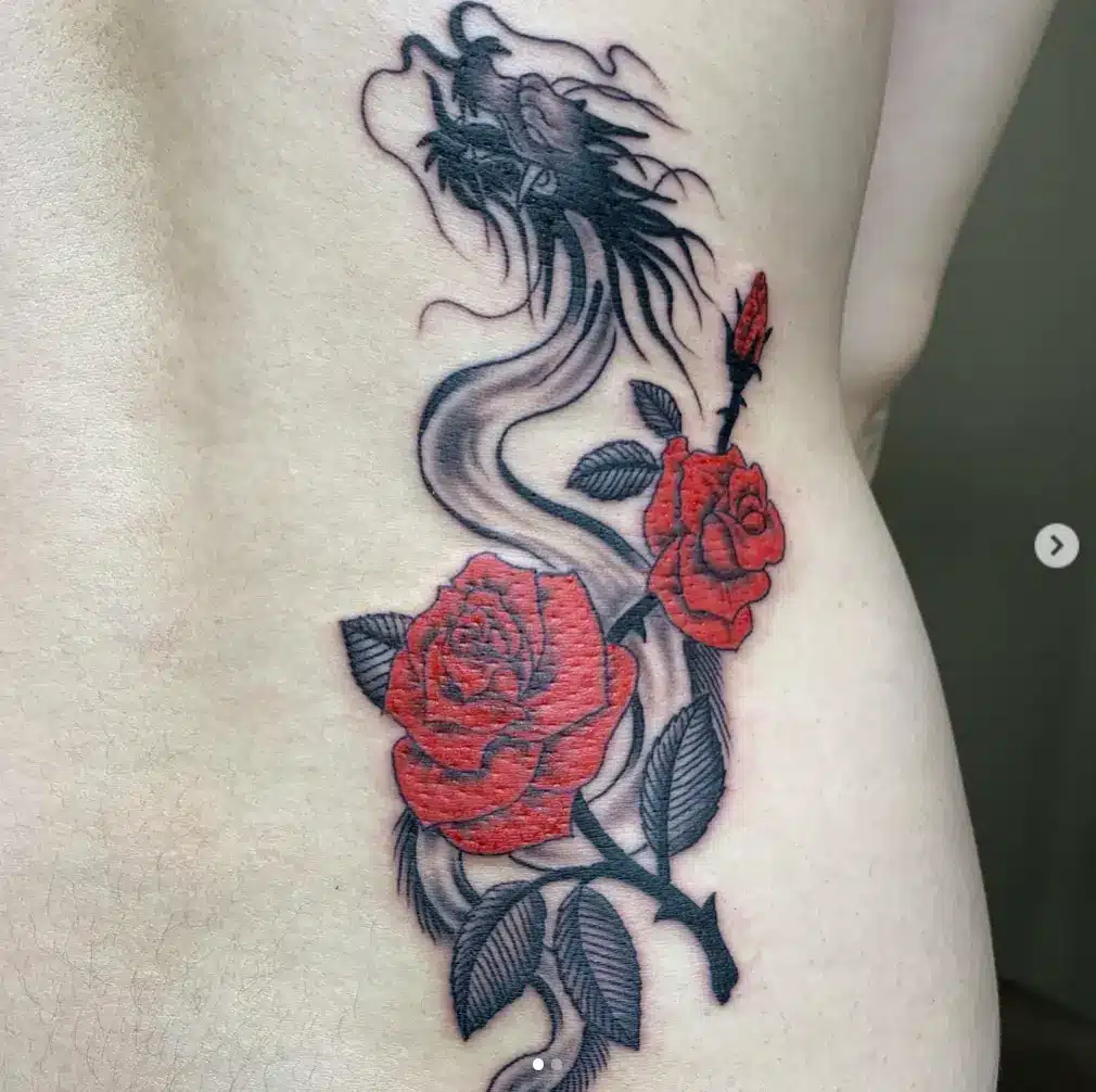 Bold contrast dragon rose tattoo