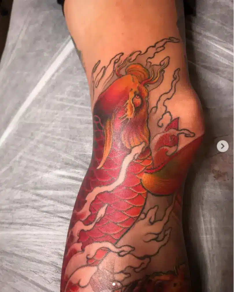 Colorful and bold dragon fish tattoo