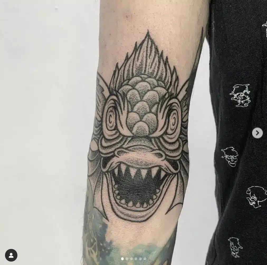 Dragonfish head tattoo