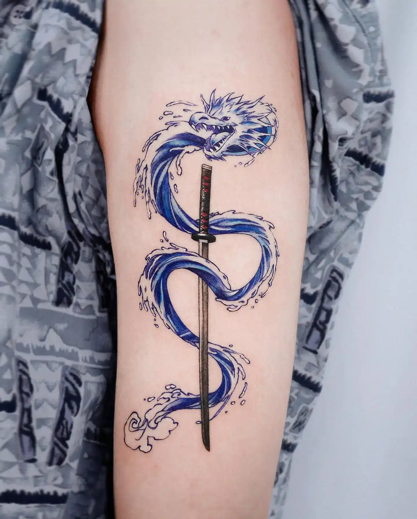 Water Dragon with a Sword Tattoo