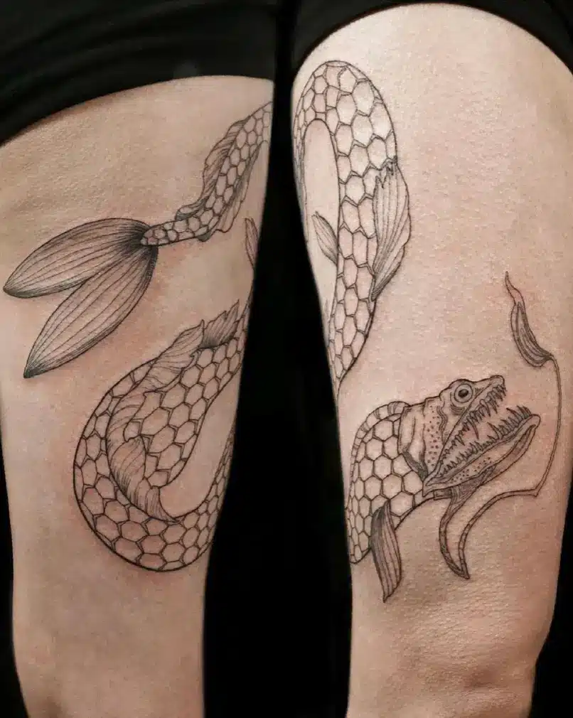 dragon fish tattoo on leg