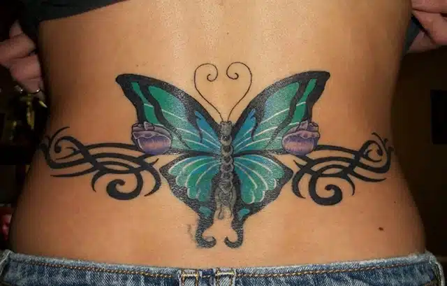 tribal butterfly tattoo on lower back