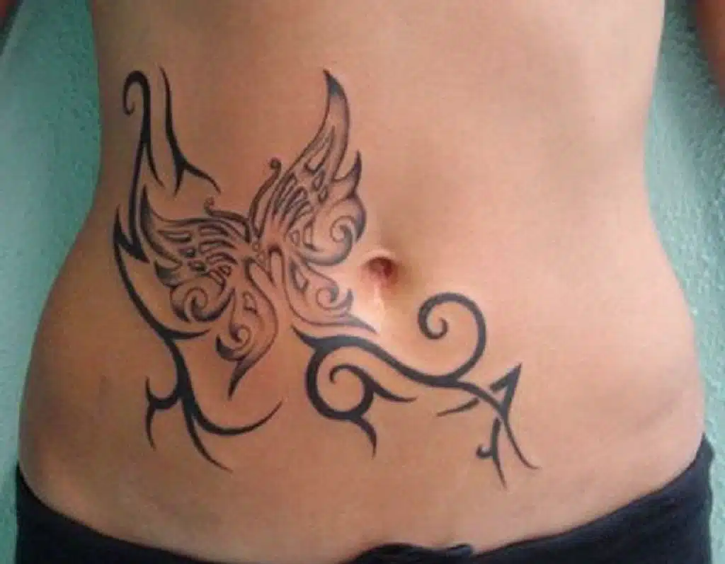 tribal butterfly tattoo on stomach