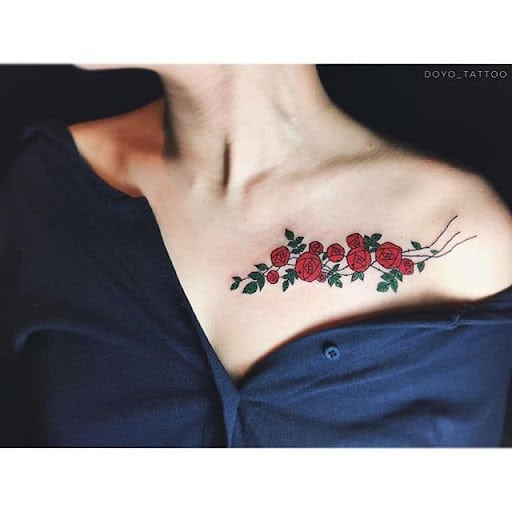 Collarbone red rose tattoo