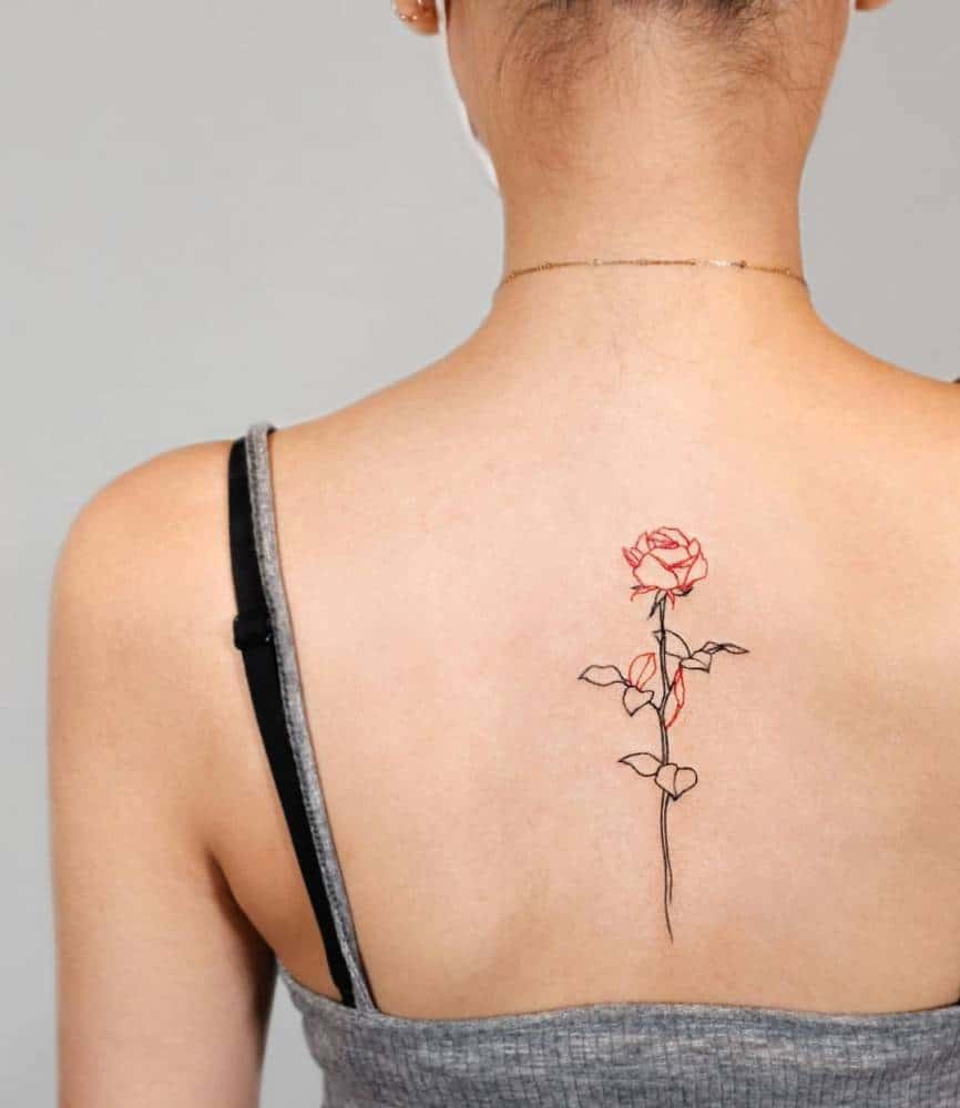 Minimalistic fine line red rose tattoo
