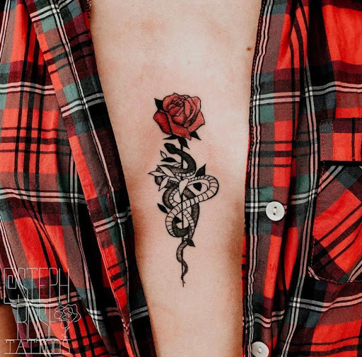 Red rose and snake tattoo