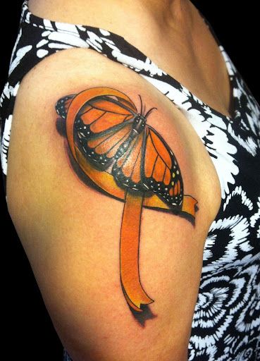 Photorealistic butterfly ribbon tattoo