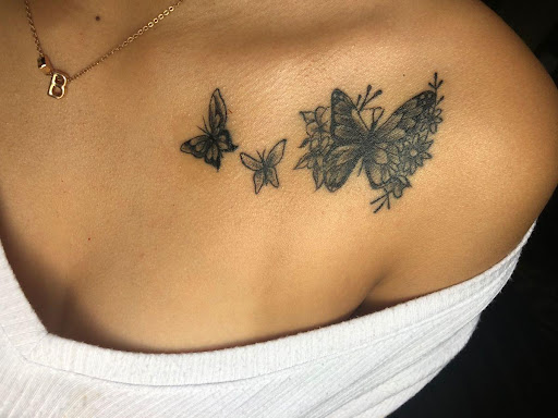 butterfly tattoo on collarbone