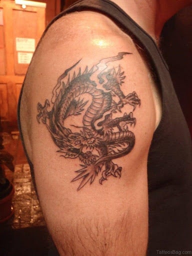 Black dragon tattoo on the shoulder