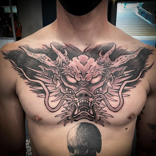 Black dragon tattoos on the chest