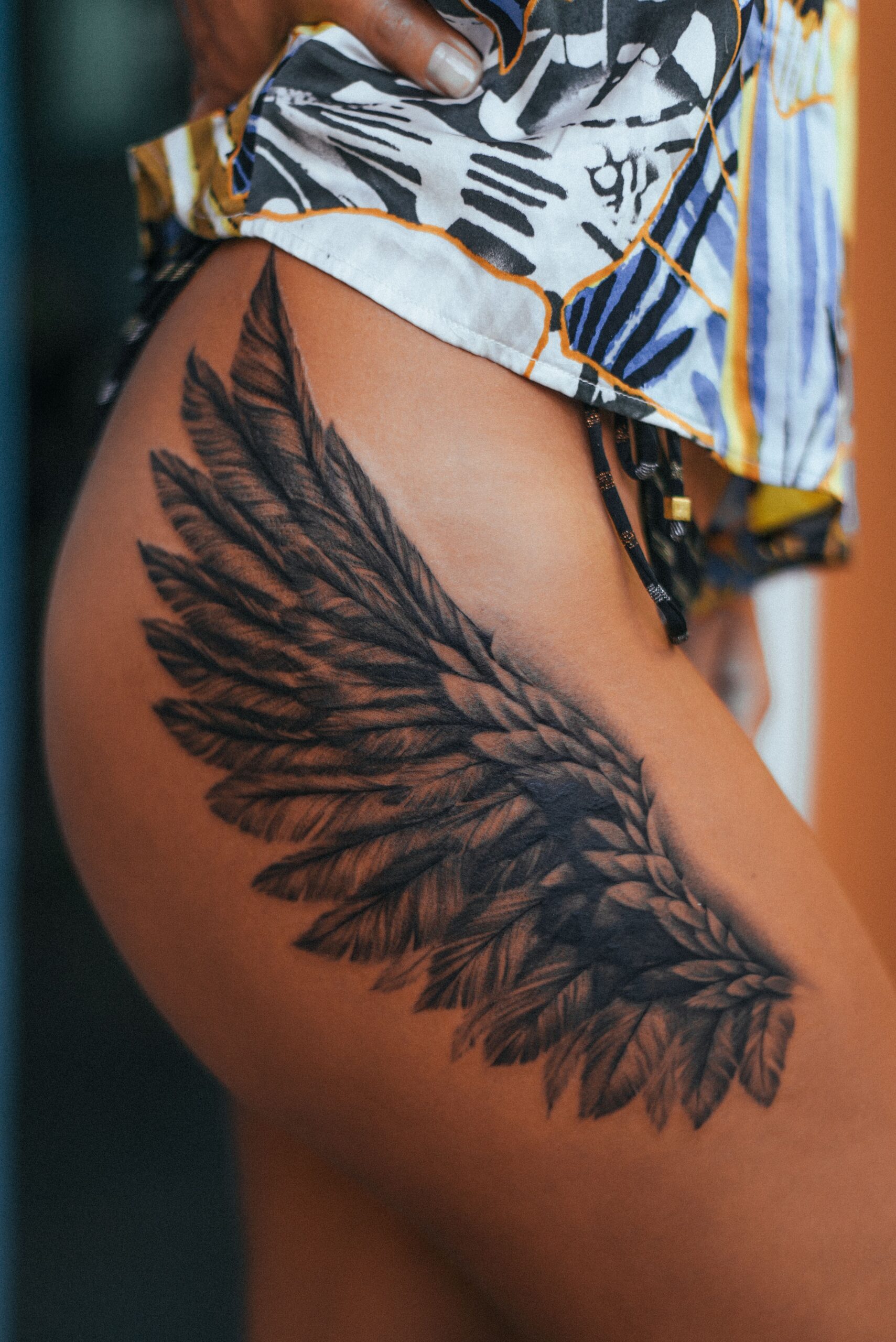 Wings Tattoo On The Back Of Leg