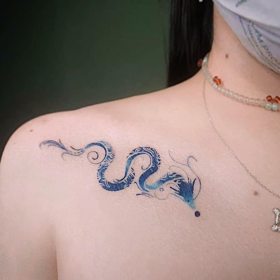 Having Blue Dragon Tattoo on Collarbone