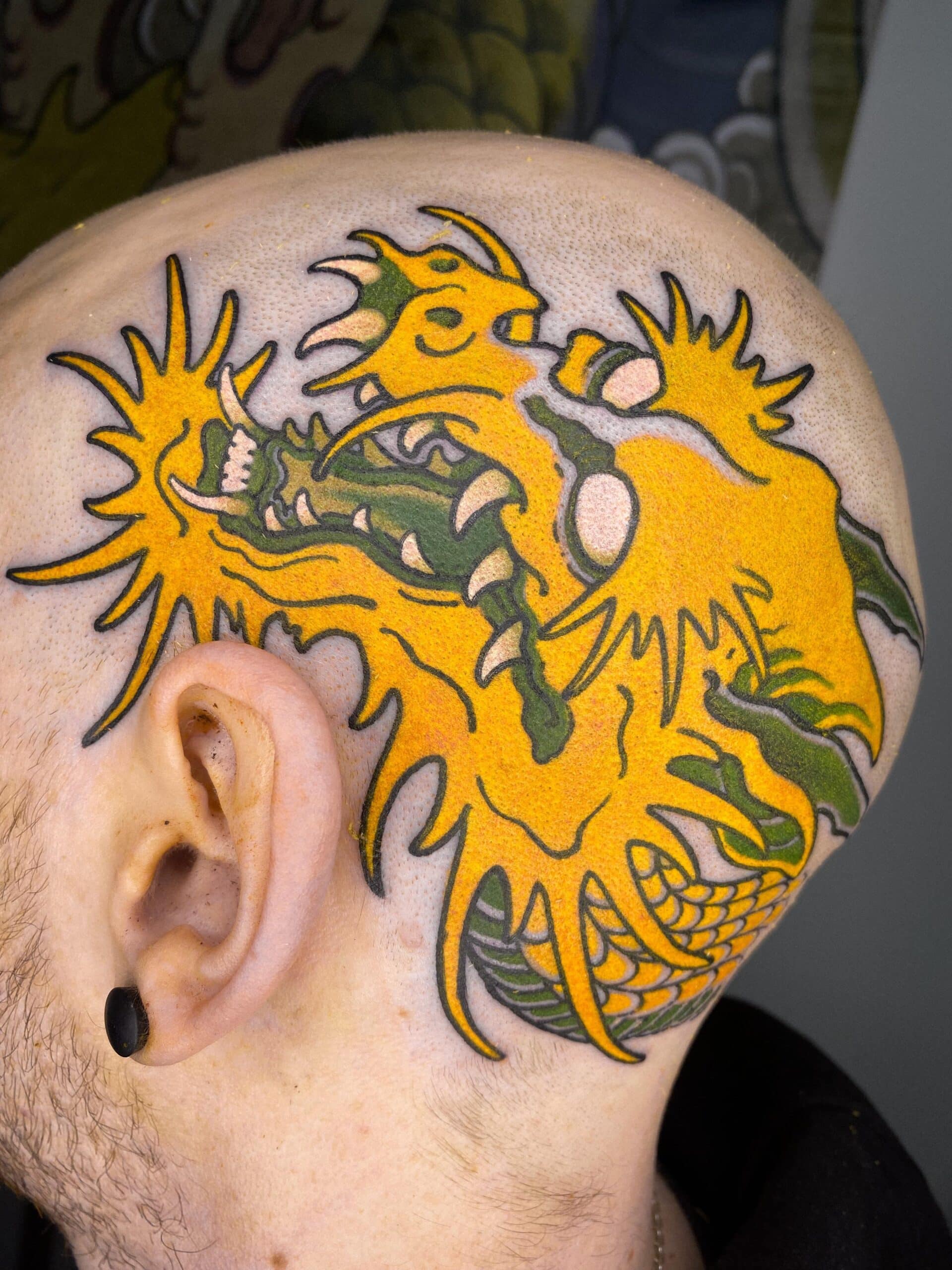 The Head with Yellow Dragon Tattoo