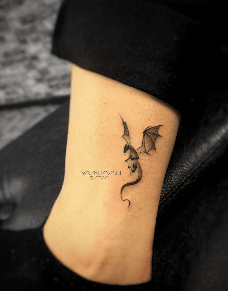 The Leg With Minimalist Dragon Tattoo