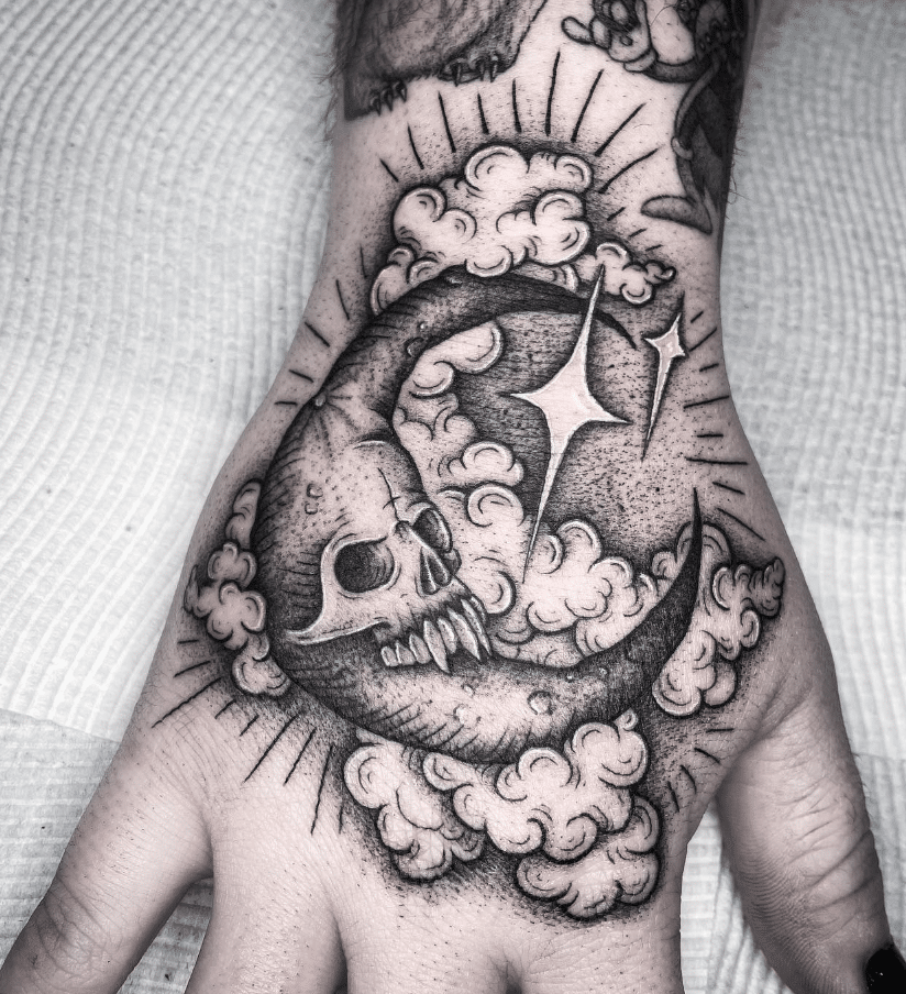 Creepy Moon Hand Tattoo