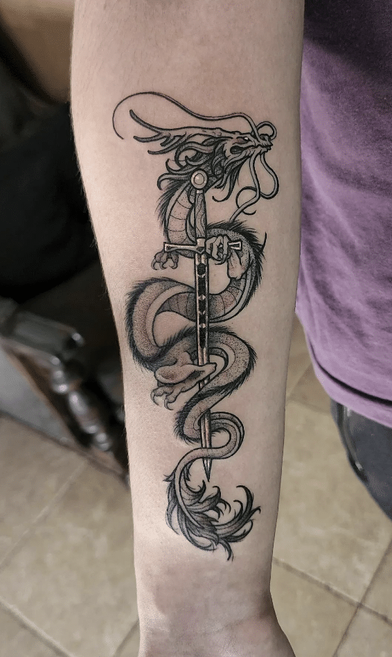 Dragon Holding Sword Tattoo