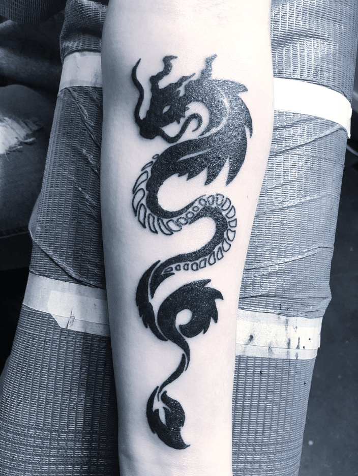 Elegant Tribal Dragon Tattoo