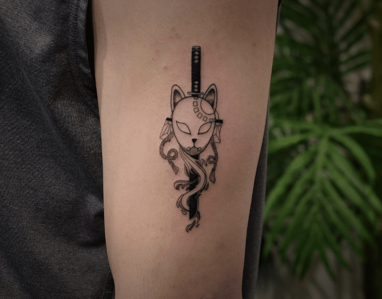 
Japanese Mask And Sword Tattoo