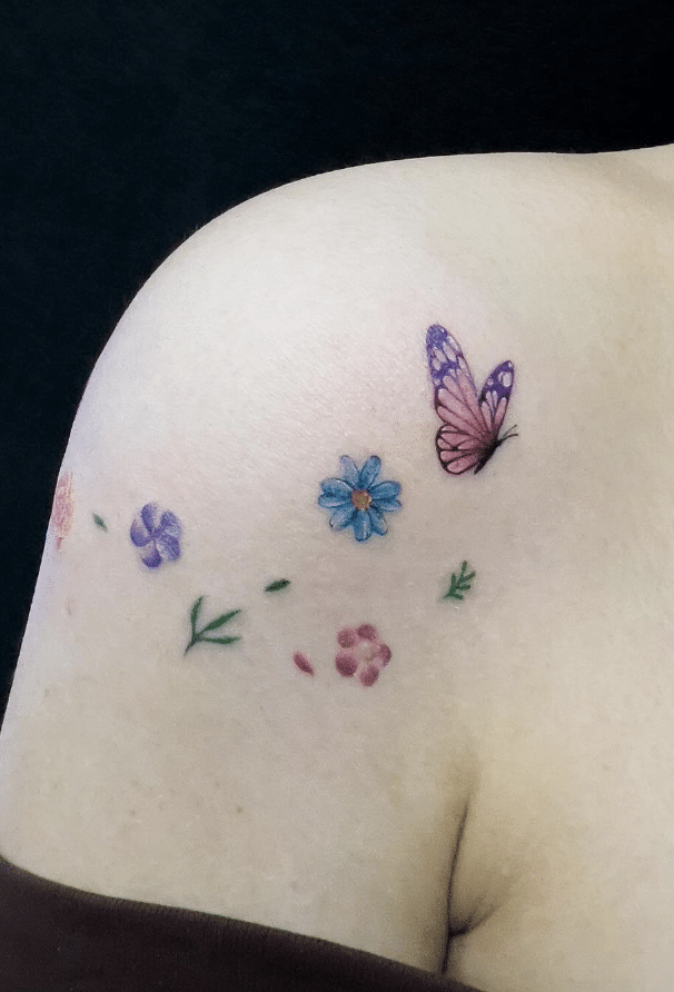 Minimalist Pink Butterfly Tattoo