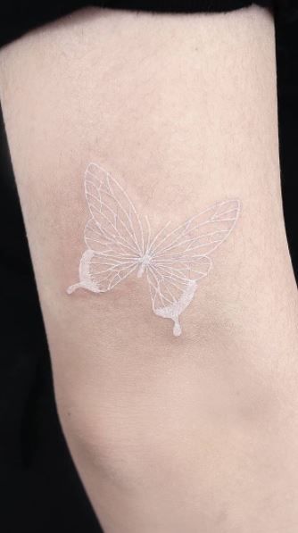Minimalist White Butterfly Tattoo Idea