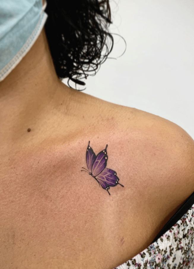 Purple Butterfly Tattoo On Clavicle
