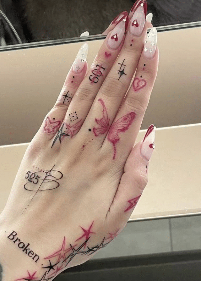 Stunning Pink Butterfly Tattoo On Finger