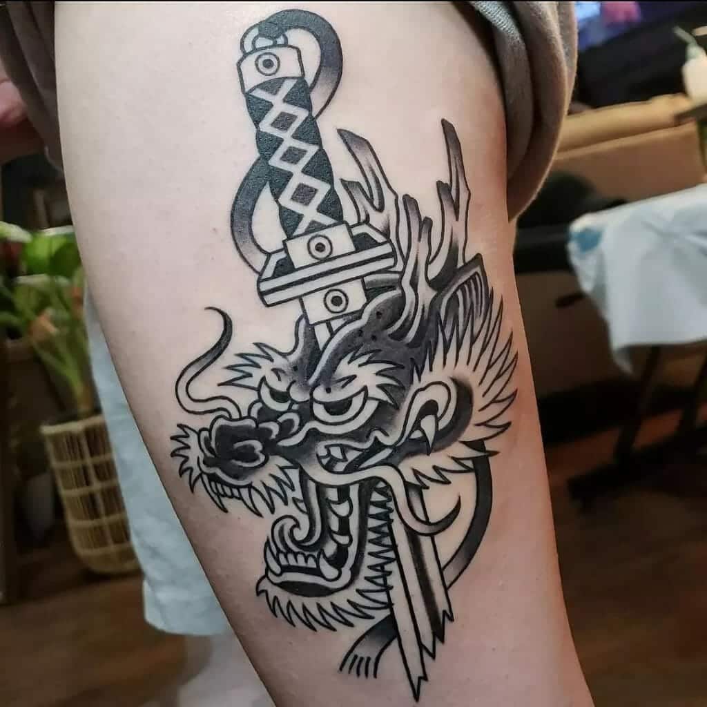 Sword Through Dragon’s Head Tattoo
