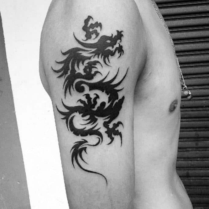 Tribal Dragon Tattoo Idea On The Arm/Leg