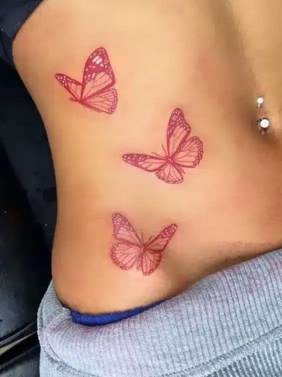 Vibrant Pink Butterfly Tattoo On Hip