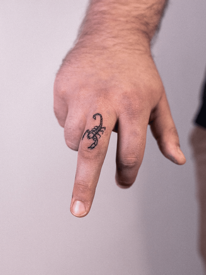 Scorpion Finger Tattoo