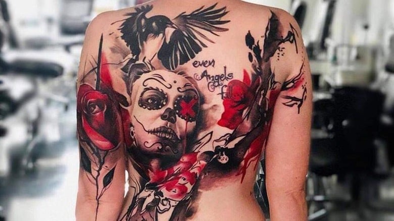 trash polka tattoo on woman back