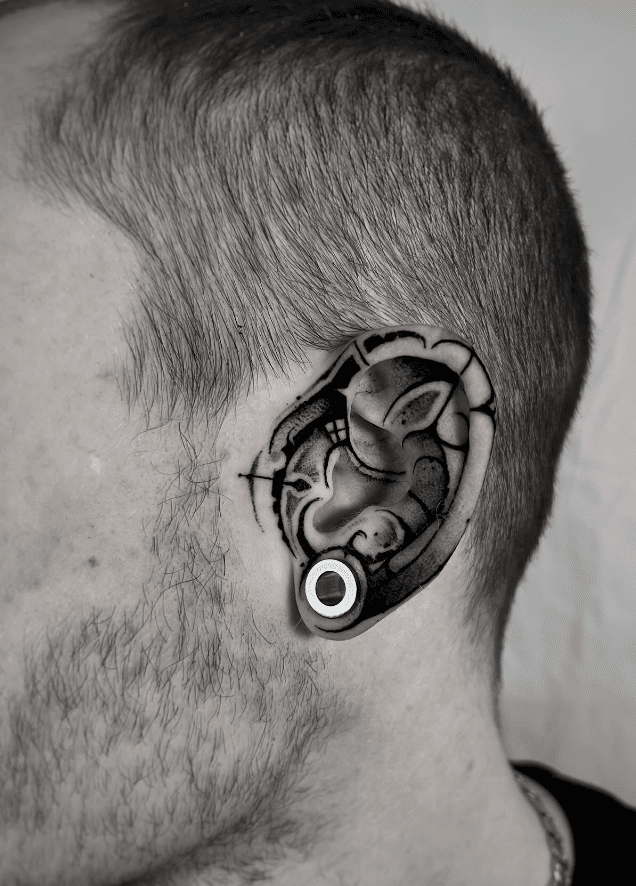 Abstract Tattoo On Ear