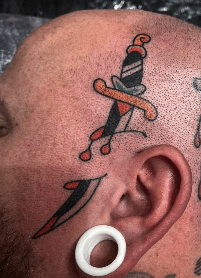 Dagger Face Tattoo