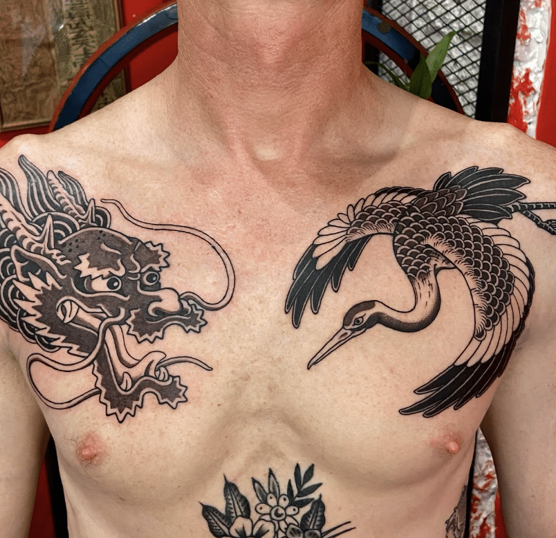 Dragon Head And Stork Tattoo
