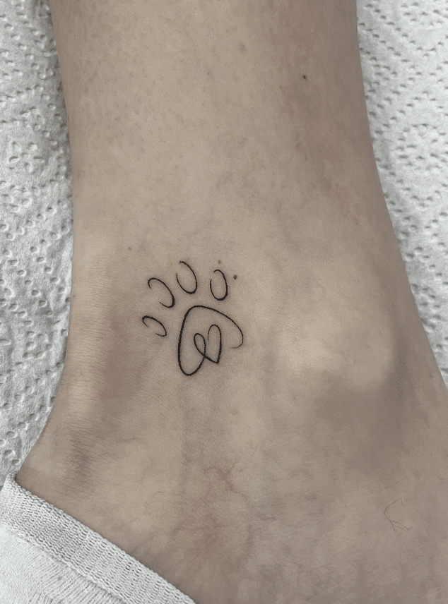 Minimalist Paw Print Tattoo