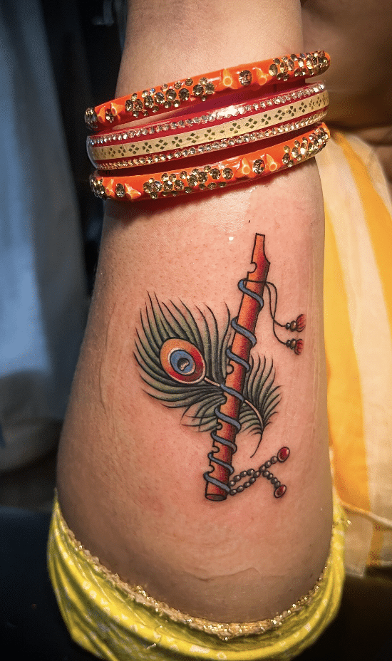 Peacock Feather And Flute Tattoo